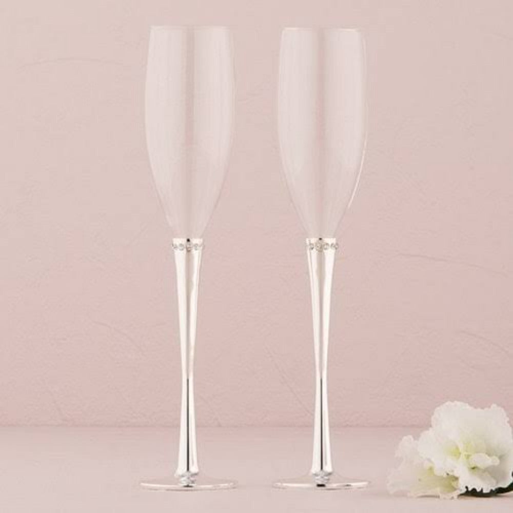 Set de copas tipo flauta para champán con tallo plateado y detalle decorativo, ideales para brindis de boda, aniversarios y celebraciones elegantes.